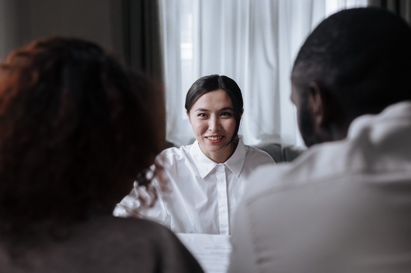 A couple getting mediated by a lawyer in their prenuptial agreement