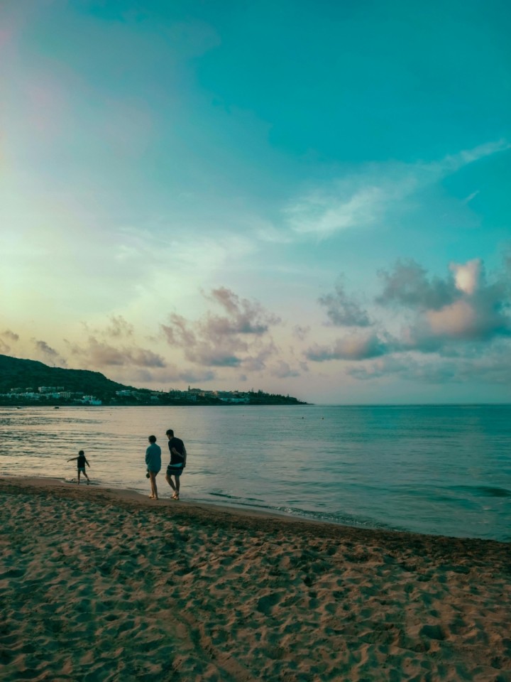 Parents with their kid on the seashore